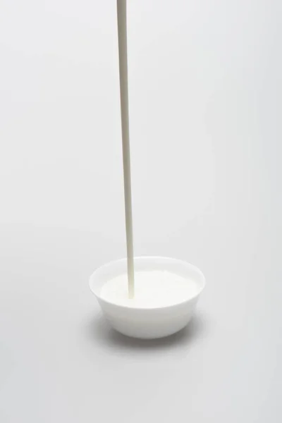 Milk Pouring Small Bowl White Background — Stock Photo, Image