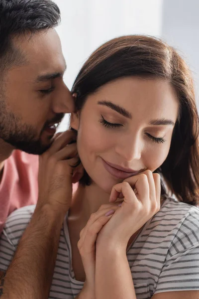 Young Man Kissing Smiling Woman Closed Eyes Hands Face Home — Stock Photo, Image