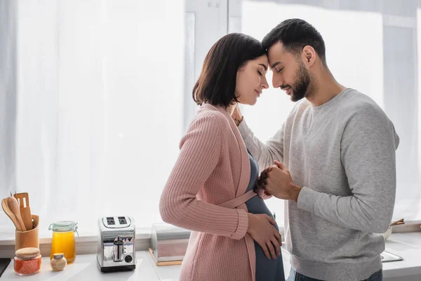 Young Man Closed Eyes Gently Holding Hand Pregnant Woman Kitchen — Stock Photo, Image