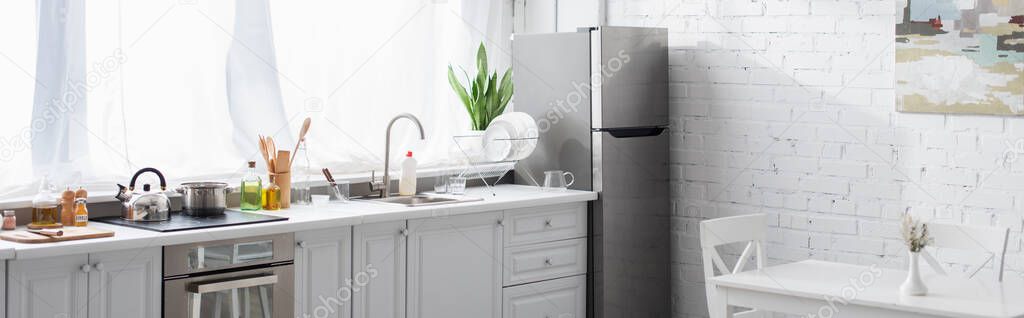modern kitchen with cooking utensils and household, banner