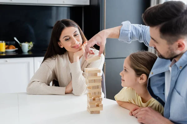 Blurred Man Taking Block Wooden Tower While Playing Together Family — Stock Photo, Image