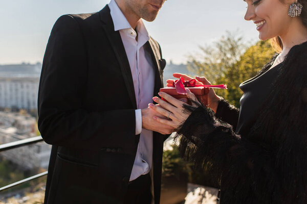 Man Giving Red Gift Box Cheerful Woman Terrace — Stock Photo, Image