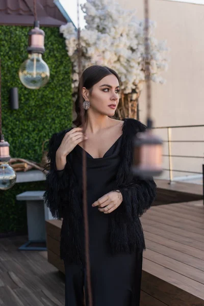 Young Woman Black Slip Dress Faux Fur Jacket Looking Away — Stock Photo, Image