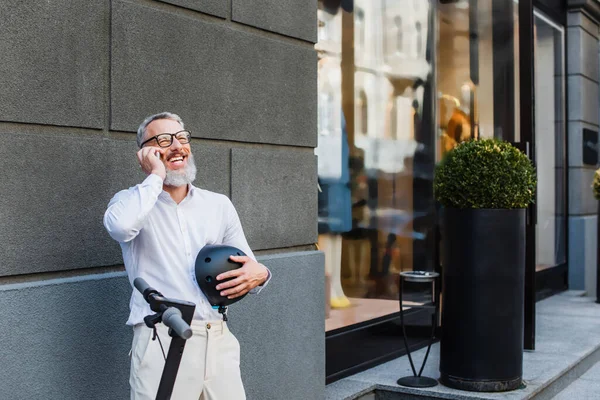 Joyful Mature Man Shirt Holding Helmet Talking Smartphone Electric Scooter —  Fotos de Stock