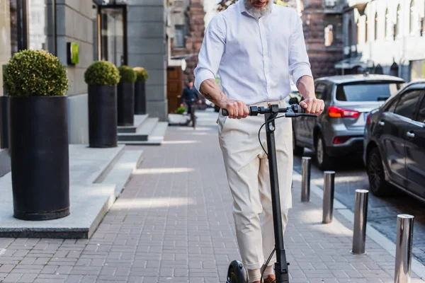 Cropped View Tattooed Mature Man Shirt Riding Electric Scooter — Foto Stock