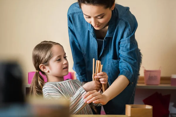 Kid Holding Wooden Sticks While Playing Educational Game Young Teacher — Stock Photo, Image