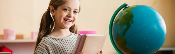 Smiling Girl Books Looking Camera Globe Montessori School Banner — Stock Photo, Image