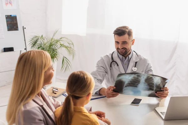 Smiling Family Doctor Fluorography Looking Blurred Mother Daughter Hospital — Stock Photo, Image