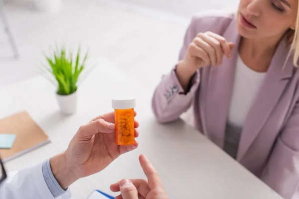 Partial View Doctor Pointing Container Pills Blurred Woman — Stock Photo, Image