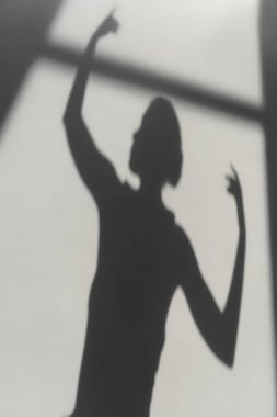 Shadow of ballerina on grey background  clipart