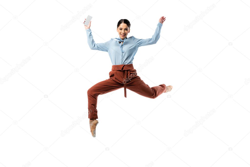 Positive ballerina jumping with smartphone isolated on white 