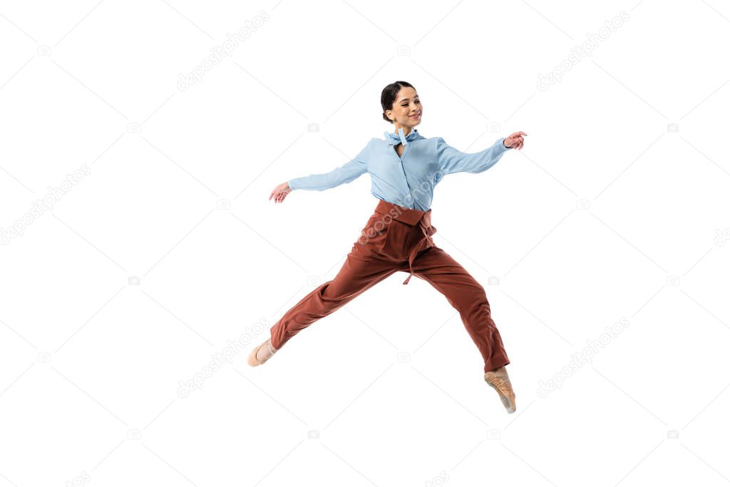 Happy elegant ballerina jumping isolated on white 