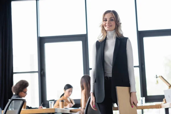 Young Successful Businesswoman Smiling Camera Multicultural Managers Working Blurred Background — Stock Photo, Image