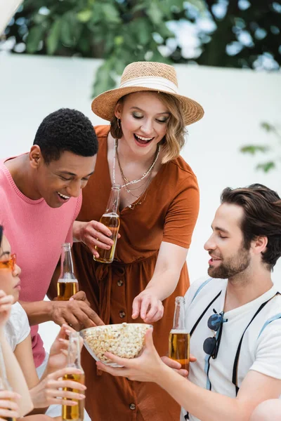Multiethnic Friends Laughing While Eating Popcorn Beer Party Patio — Stockfoto