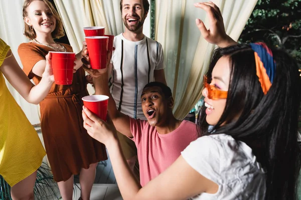 Excited African American Friend Holding Plastic Cup Friends Patio — Zdjęcie stockowe