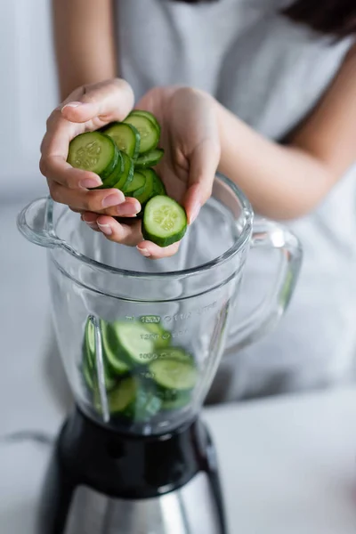 Cropped View Blurred Woman Adding Cut Cucumber Electric Shaker — Stock Photo, Image
