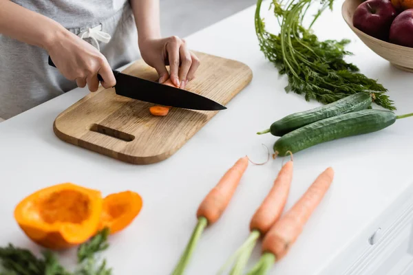 Partial View Woman Cutting Carrot Fresh Cucumbers Carrots Pumpkin Table — Stock Photo, Image