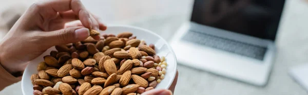 Vue Partielle Femme Avec Bol Amandes Près Ordinateur Portable Flou — Photo