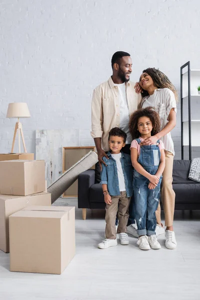 Happy African American Family Smiling Cardboard Boxes New Apartment — Stock Photo, Image