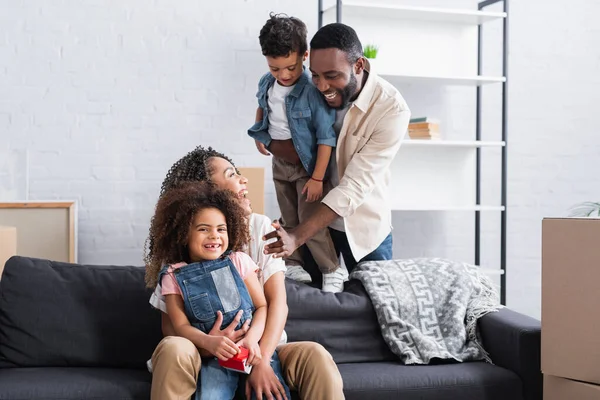 Cheerful African American Couple Looking Each Other Kids New Apartment — Stock Photo, Image