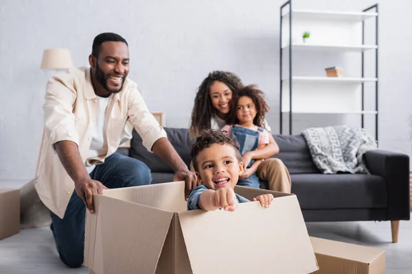 Cheerful African American Boy Playing Cardboard Box Happy Family — Stock Photo, Image