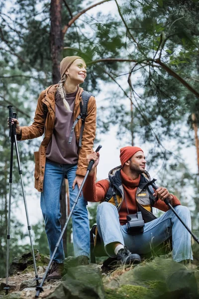 Joyful Couple Hats Holding Hiking Sticks While Resting Trekking Forest — Φωτογραφία Αρχείου