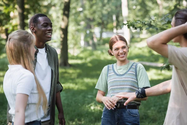 Smiling Interracial Teenagers Looking Blurred Friend Park — Stock Photo, Image