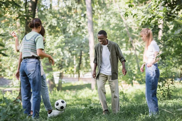 Cheerful Teenagers Playing Football Interracial Friends Grass — Stock Photo, Image