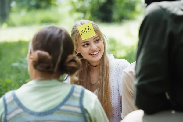 Smiling Teenager Milk Lettering Sticker Playing Who Multiethnic Friends — Stock Photo, Image