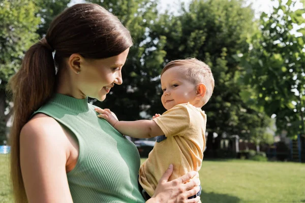 Cheerful Young Mother Holding Arms Happy Toddler Son — Stock Photo, Image
