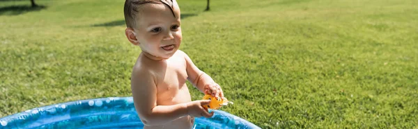 Toddler Boy Swim Trunks Standing Inflatable Pool Rubber Toy Banner — Stock Photo, Image