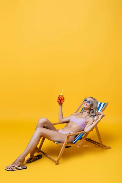 Happy Young Woman Swimsuit Sitting Deck Chair Cocktail Yellow — Stock Photo, Image