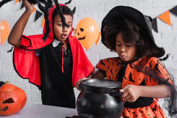 African American Girl Halloween Costume Holding Witch Cauldron Potion Brother — Stock Photo, Image