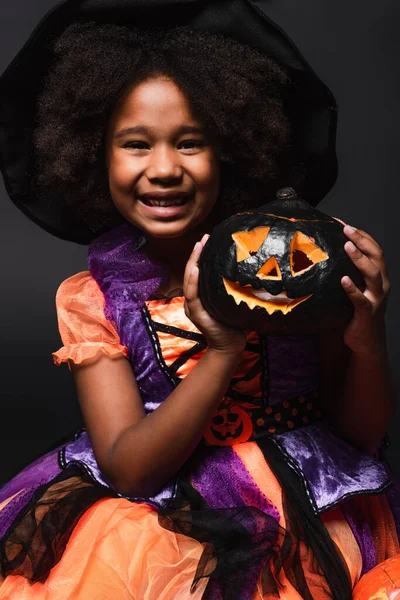 Happy African American Girl Pointed Hat Holding Carved Pumpkin Isolated — Stock Photo, Image
