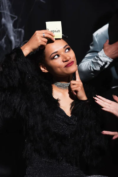 Smiling African American Woman Halloween Costume Playing Guess Who Game — Stock Photo, Image