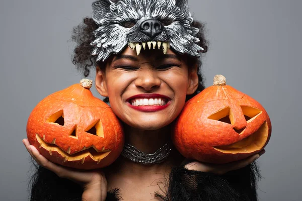 Overjoyed African American Woman Wolf Halloween Mask Holding Carved Pumpkins — Stock Photo, Image