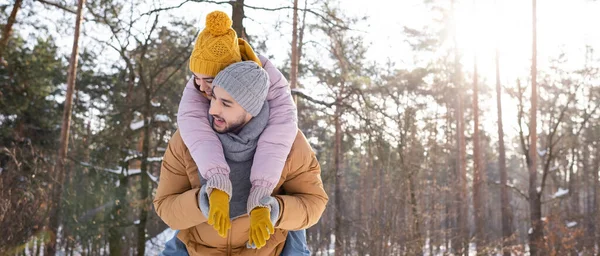 Cheerful Woman Piggybacking Boyfriend Winter Park Banner — Stock Photo, Image