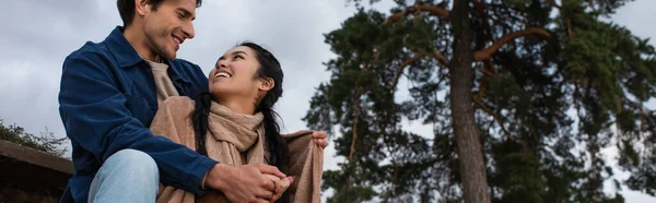 Low Angle View Smiling Man Hugging Asian Girlfriend Blanket Outdoors — Stock Photo, Image