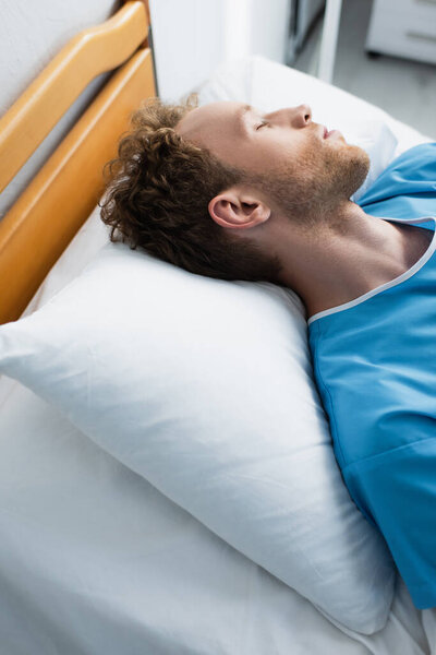 high angle view of patient sleeping on hospital bed