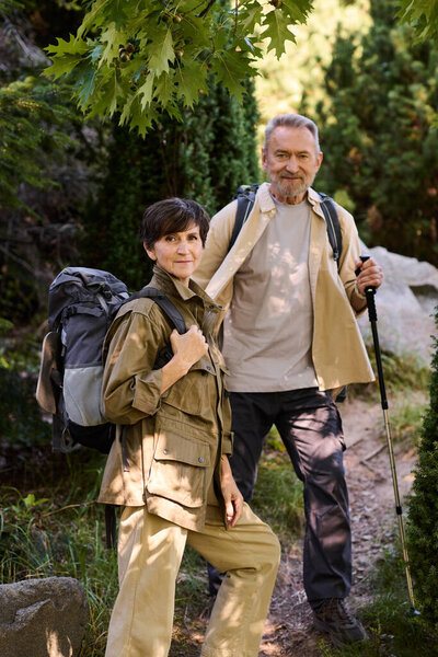 Active seniors explore scenic trails together, embracing adventure and travel in nature.