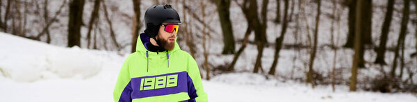 A bearded man expertly snowboards down a snowy slope on a bright winter day, banner