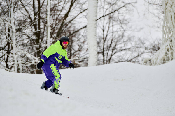 A bearded man snowboards down a snowy slope amidst a serene winter landscape.