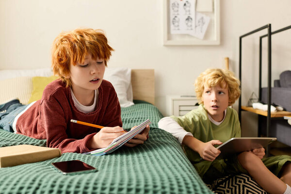 Two boys engage in fun activities together at home, enjoying their time.