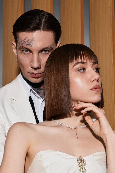 A modern couple expresses their deep connection in a luxurious hotel environment.