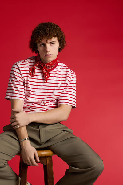 Smartly dressed teenager strikes a dynamic pose, exuding confidence and energy.