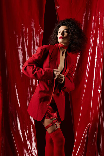 A chic young Black woman in a red outfit embodies the Valentines Day spirit.