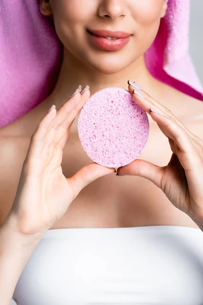 Cropped view of woman holding sponge — Stock Photo