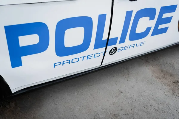 Patrol car with blue police lettering outdoors — Stock Photo