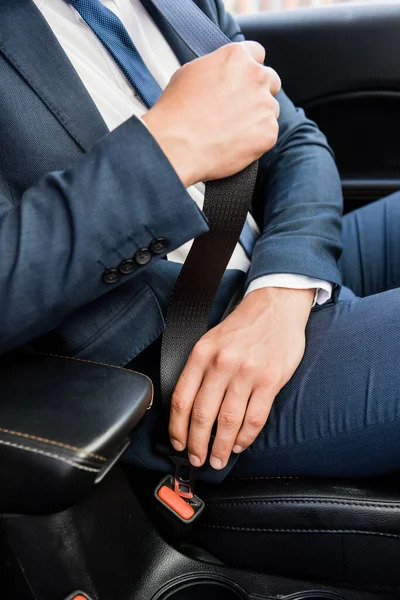 Cropped view of businessman locking lifesaver in car — Stock Photo