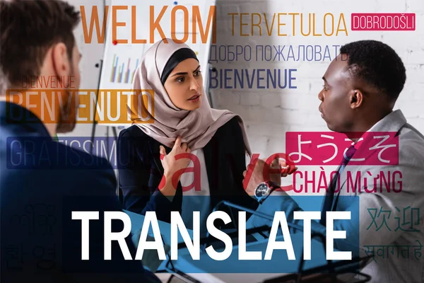 Arabian businesswoman talking to african american businessman near interpreter, translate lettering near words in different languages. Translation: 